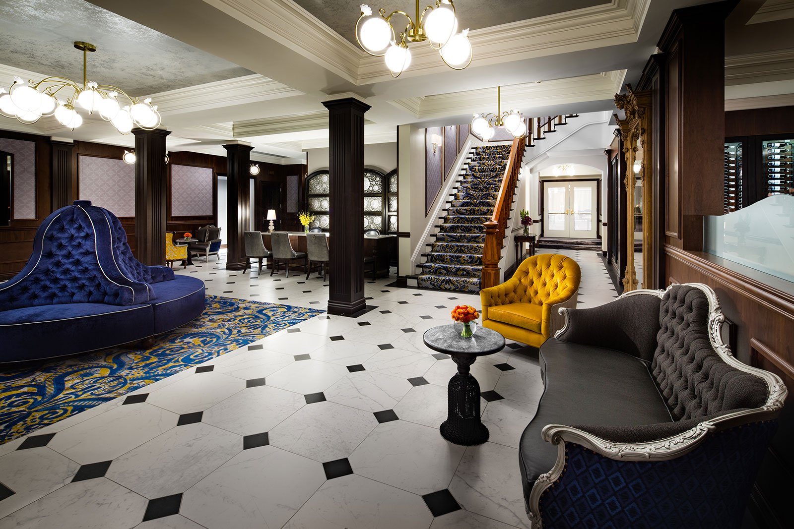 Lobby of The Adelphi Hotel with marble floor and seating